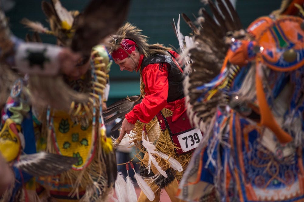 Cherokee descendant Jake Reed dances during a pow wow on April 9, 2016 at the Jenison Field House. This event was put on by North American Indigenous Student Organization which strives to promote education and motivate the Native Student Community at MSU.