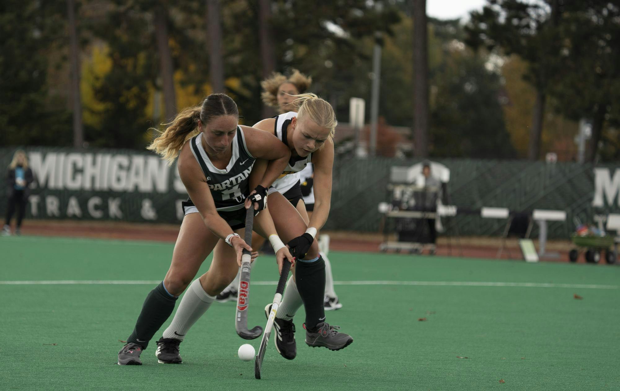 Fast-paced field hockey ball passes between Iowa and MSU in a competitive matchup at MSU's Ralph Young Field on Oct. 25, 2024.