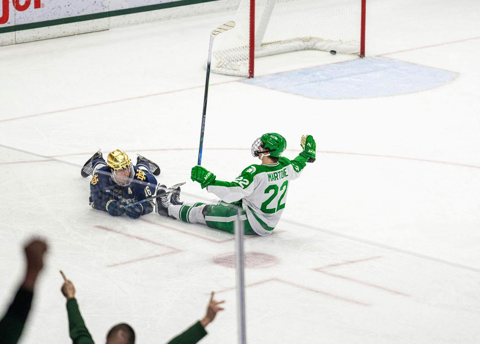 MSU Fr. F, Porter Martone (22), scores a goal and slides across the ice sitting down after Notre Dame puts all of their players on the attack leaving an open net in Munn Ice Arena in East Lansing, MI on Feb. 19, 2026.