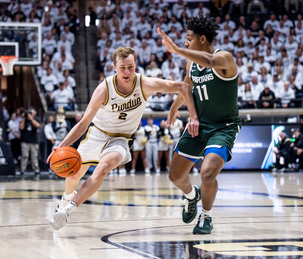 <p>Purdue's freshman guard Fletcher Loyer (2) drives the ball as junior guard A.J. Hoggard (11) guards him during a game against Purdue at Mackey Arena on Jan. 29, 2023. The Spartans lost to the Boilermakers 77-61.</p>