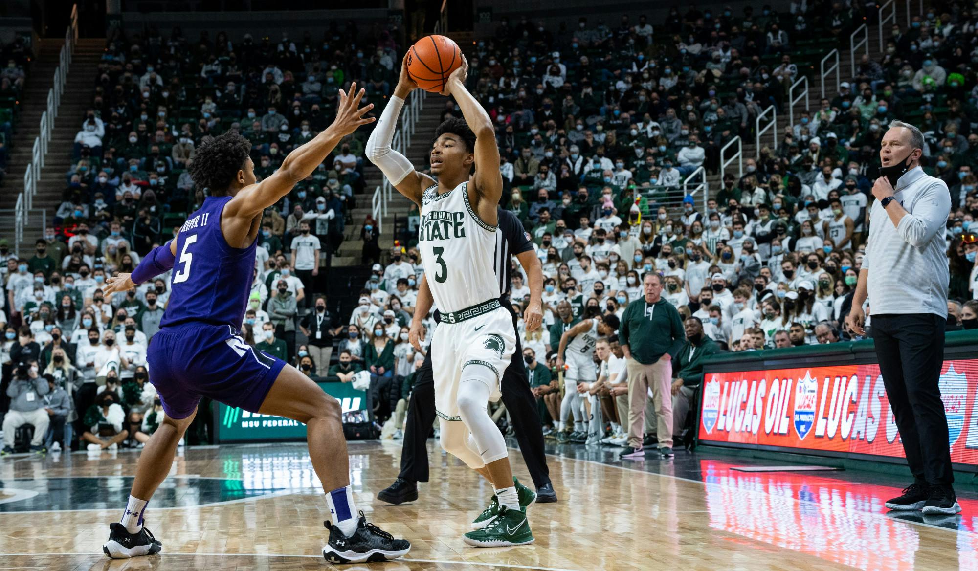 <p>Northwestern&#x27;s freshman guard Julian Roper II (5) attempts to guard Michigan State&#x27;s freshman guard Jaden Akins (3) during Michigan State&#x27;s loss on Jan. 15, 2022.</p>