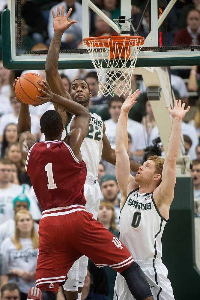 	<p>Junior forward Branden Dawson, 22, and junior guard Russell Byrd block Indiana forward Noah Vonleh on Jan. 21, 2014, at Breslin Center. The Spartans defeated the Hoosiers, 71-66. Julia Nagy/The State News</p>