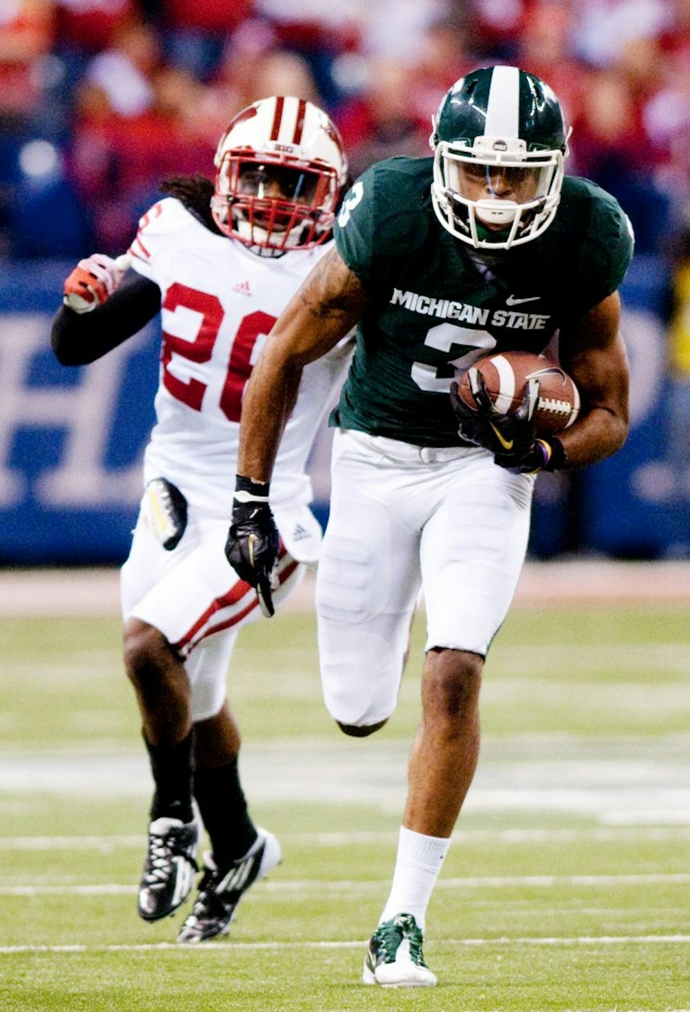 Senior wide receiver B.J. Cunningham breaks into the open field after pulling in a catch. The Spartans lost to the Wisconsin Badgers, 42-39, in the Big Ten Championship game on Saturday night at Lucas Oil Stadium in Indianapolis, Ind. Josh Radtke/The State News