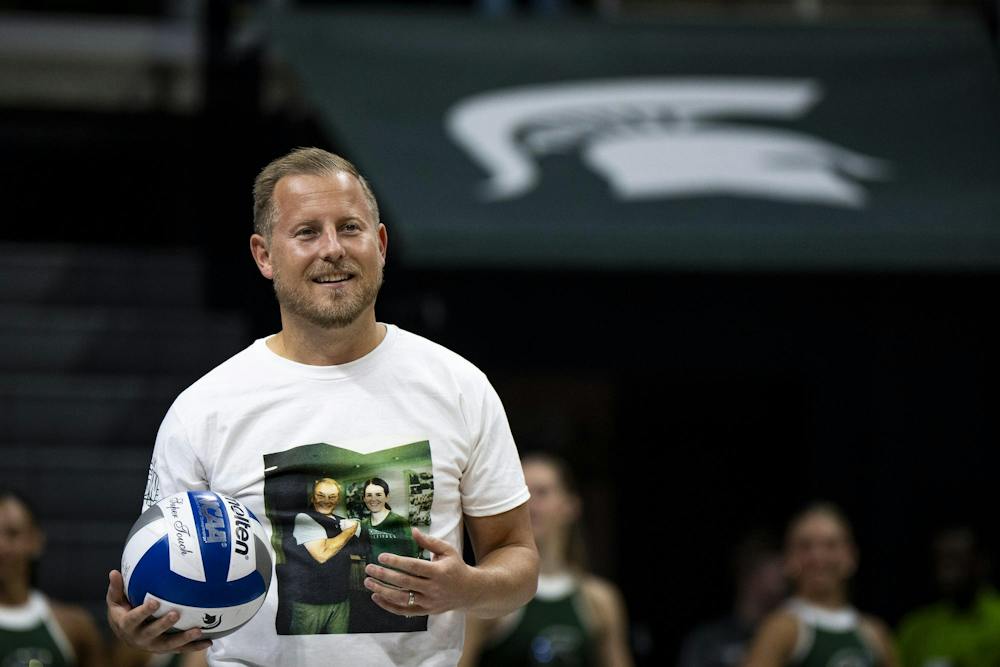 <p>Michigan State athletic director Dan Bartholomae takes the ceremonial first serve before a match at the Breslin Center in East Lansing, Mich., on Friday, Sept. 25, 2026.</p>