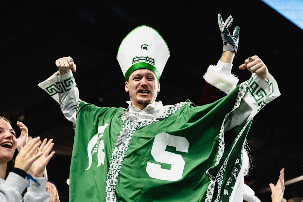 <p>A fan dressed as a priest celebrates at the Ford Field Stadium in Detroit, MI, on Nov. 29, 2025.</p>