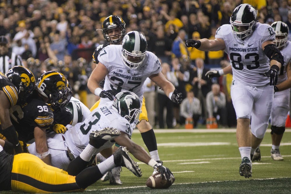 Freshman running back LJ Scott makes the game winning touchdown on Dec. 5, 2015 during the Big Ten championship game against Iowa at Lucas Oil Stadium in Indianapolis. The Spartans defeated the Hawkeyes, 16-13.