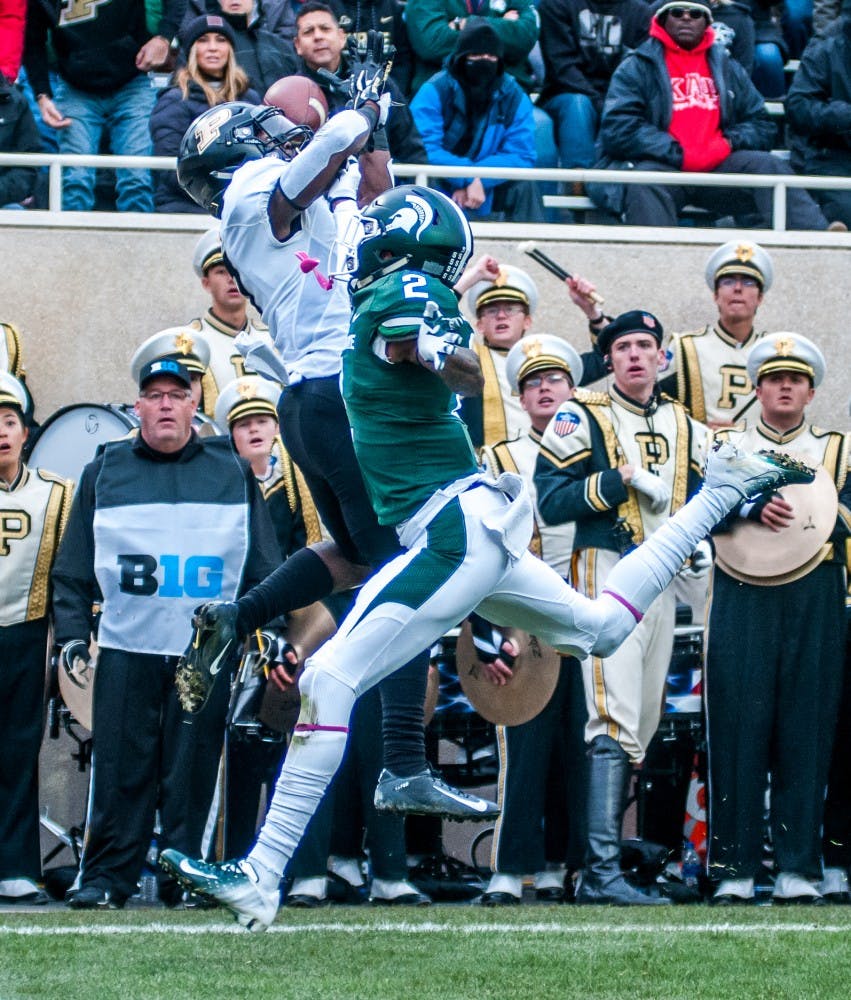 Junior corner back Justin Layne (2) breaks up a deep pass during the game against Purdue on Oct. 27, 2018 at Spartan Stadium. The Spartans lead the Boilermakers 13-6 at half.