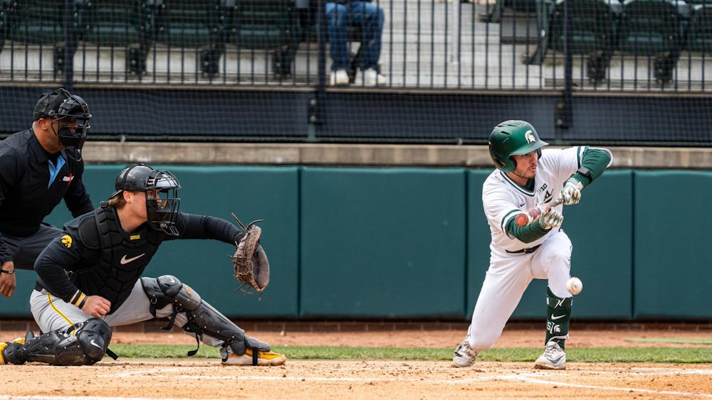 MSU So. INF, Dayton Murphy (3), bunts the ball in the Jeff Ishbia Field in McLane Stadium in East Lansing, MI on March 21, 2026.