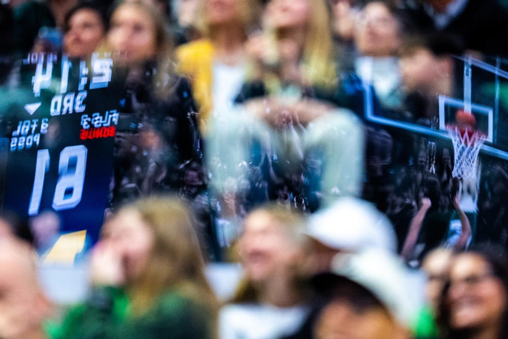 Michigan Wolverines guard Mila Holloway (3) scores a basket during the women’s rivalry matchup at the Breslin Student Events Center in East Lansing, Mich., on Sunday, Feb. 1, 2026.