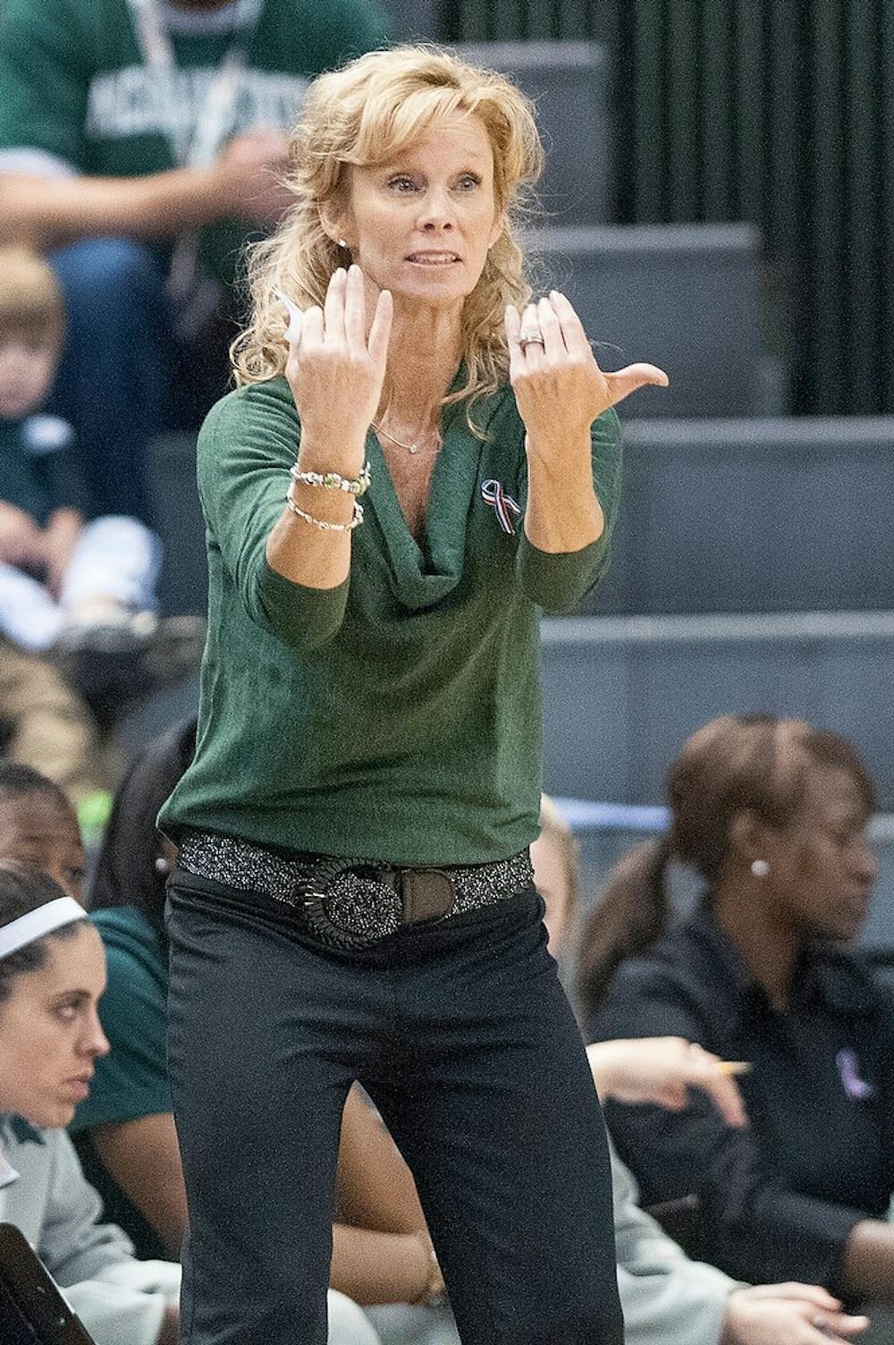 	<p>Head coach Suzy Merchant gestures to players from the sidelines. The Spartans defeated the Mavericks, 83-39, Nov. 11, 2012, at Breslin Center. Justin Wan/The State News</p>