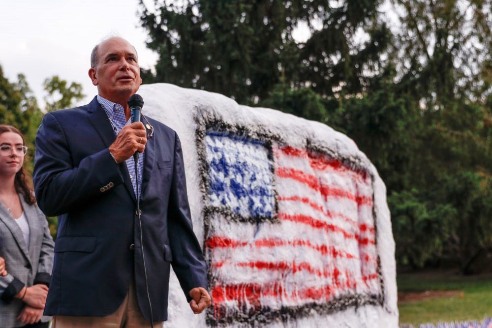 Steve Bucci, who was at the Pentagon on the day of the attack, speaks during the September 11th Memorial at the Rock on Farm Lane.