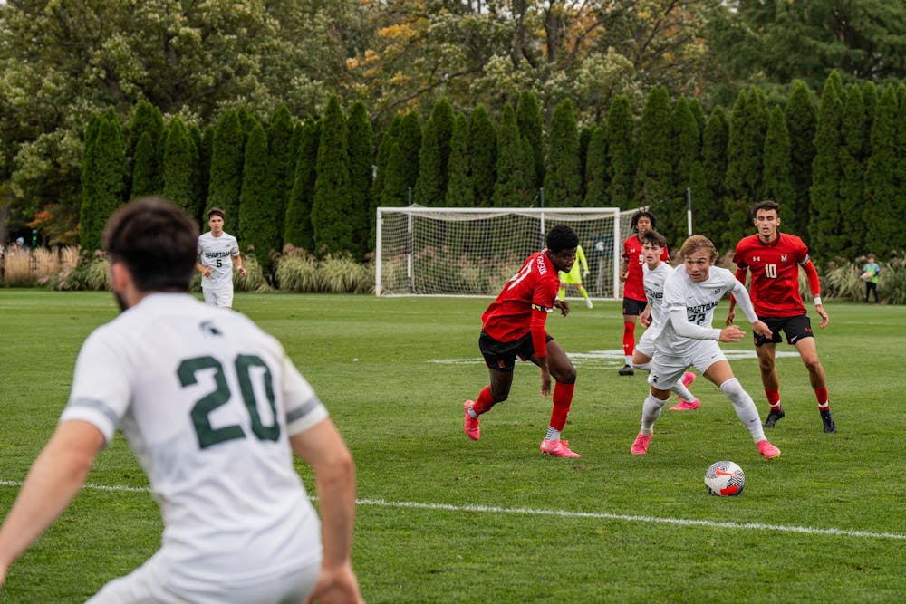 <p>Michigan State University sophomore forward Jake Spadafora (22) running with the ball at DeMartin Soccer Complex on Oct. 15, 2023. </p>
