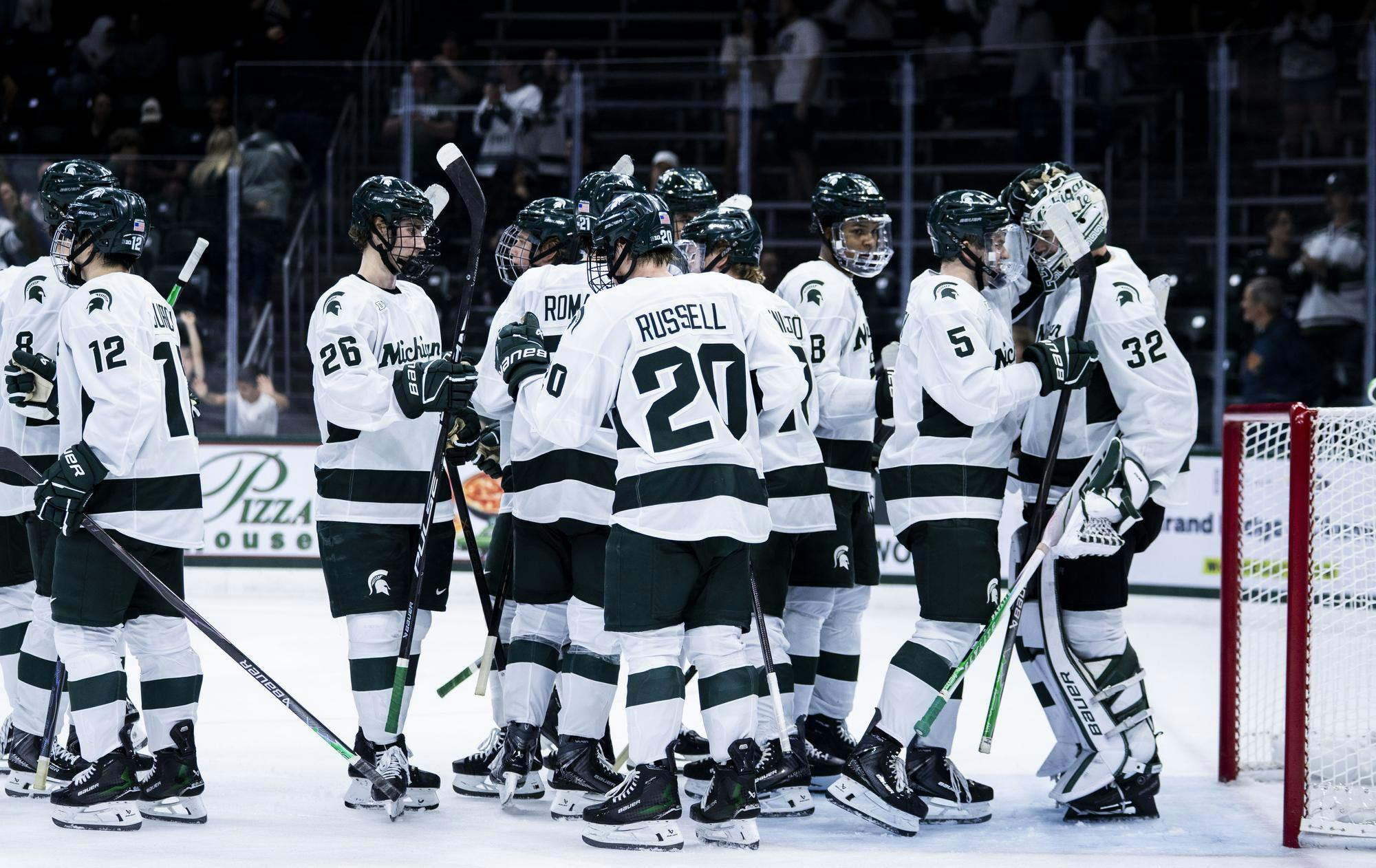 The MSU men’s hockey team celebrates after winning their exhibition against Windsor 4-0 in the Munn Ice Arena on Oct. 3, 2025. 