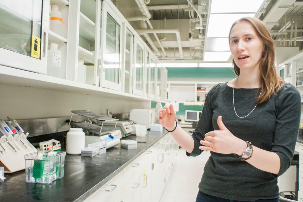 Chemical engineering senior Rebecca Carlson explains lab equipment on March 30, 2017 at Engineering Building. Carlson is one of 12 students nationwide to receive the Hertz Fellowship. Carlson said this will provide her funding to choose what research project she will be doing and connects her to other Hertz fellows, providing an opportunity for them to learn from each other. 