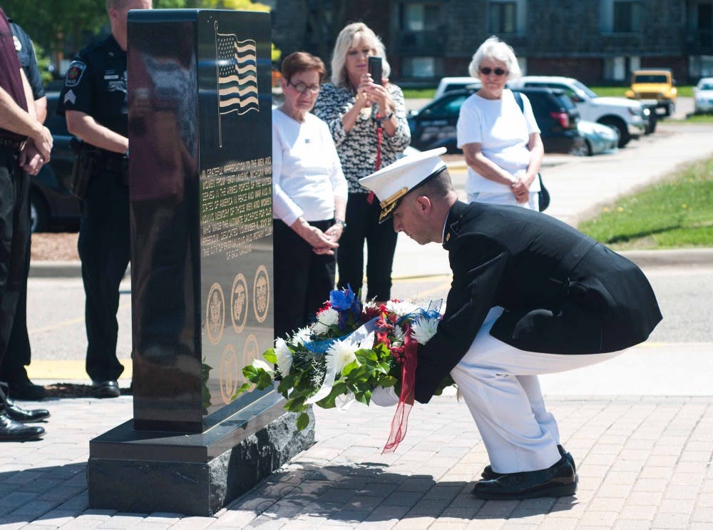 Instructor, Company C, 1st Battalion, 24th Marines Bert Reinink lays a wreath during the Medal of Honor Memorial wreath laying at the Hannah Community Center on May 24, 2018. (Annie Barker | State News)
