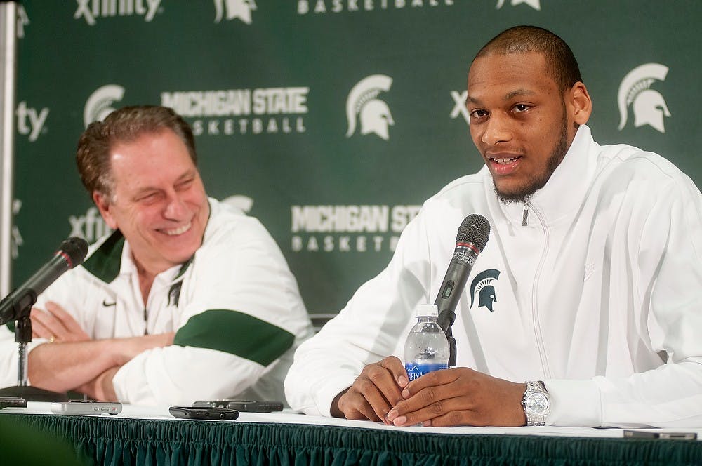 	<p>Head coach Tom Izzo, left, and junior forward Adreian Payne joke during a press conference announcing Payne&#8217;s decision to finish out his college career and not enter the 2013 <span class="caps">NBA</span> Draft on April 28, 2013, at Breslin Center. Julia Nagy/The State News</p>