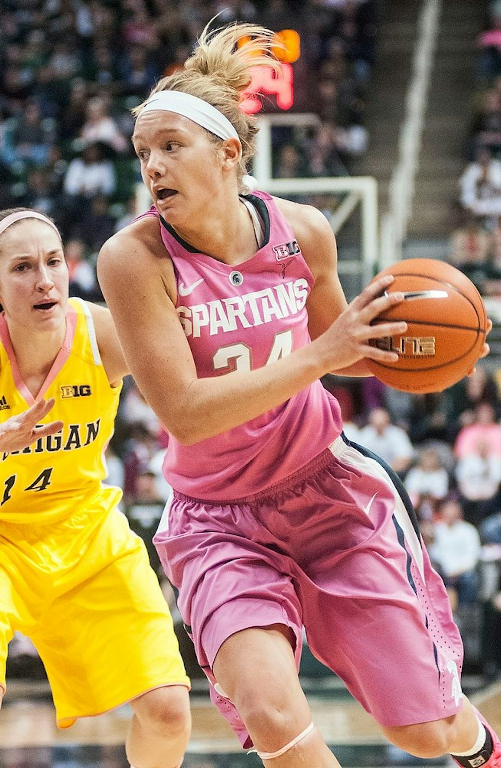 	<p>Senior forward Courtney Schiffauer drives the ball toward the basket Monday, Feb. 4, 2013, at Breslin Center. The Spartans defeated Michigan, 61&#8212;46, improving their record to 6-3 in the Big Ten. Adam Toolin/The State News</p>