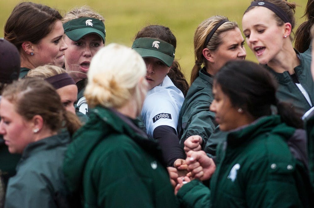 <p>The team puts their hands in together April 4, 2014, before a game against Penn State at Secchia Stadium at Old College Field. The Spartans lost to the Nittany Lions, 9-3. Erin Hampton/The State News</p>