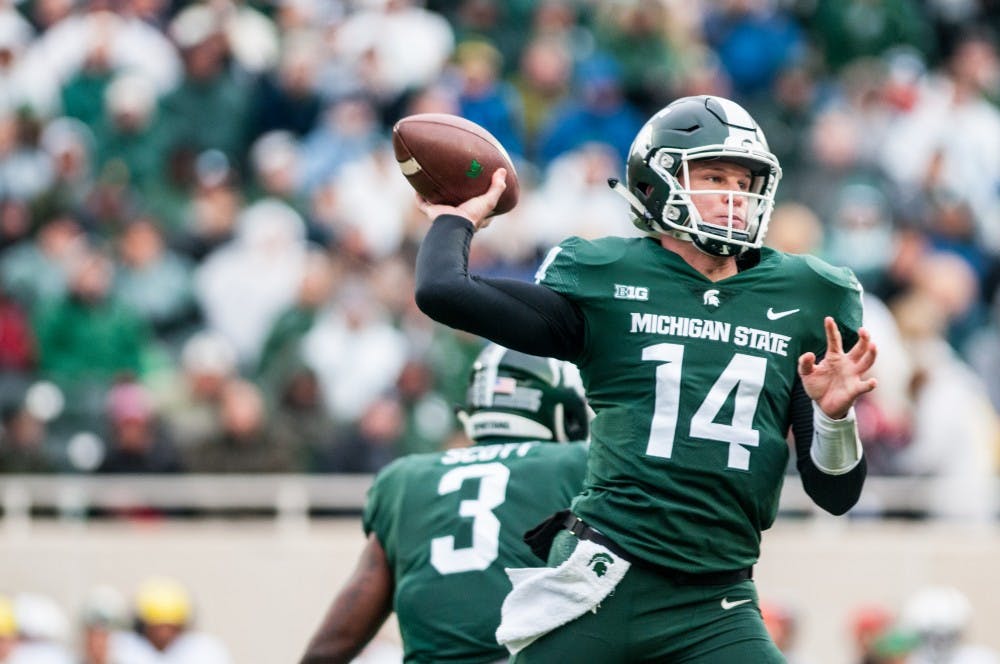 <p>Sophomore quarterback Brian Lewerke (14) throws the football during the game against Penn State, on Nov. 4, 2017, at Spartan Stadium. The Spartans defeated the Nittany Lions, 27-24.</p>