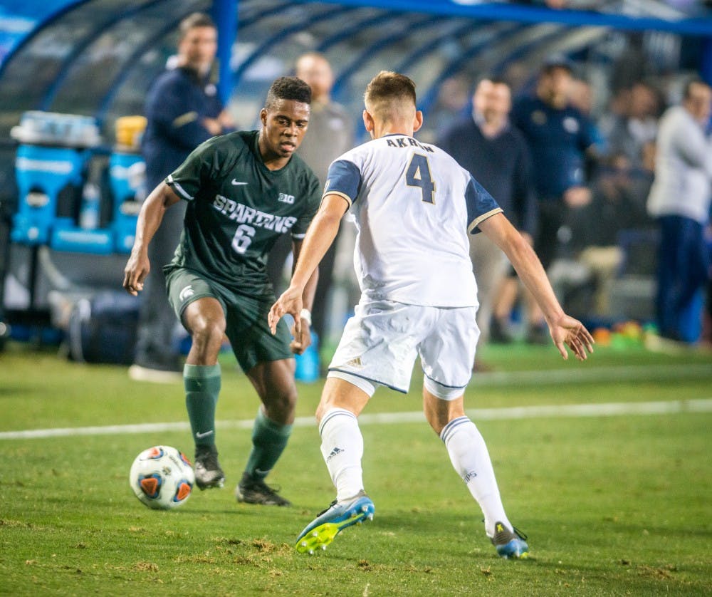 <p>Forward DeJuan Jones (6) looks to make a move to get around the defender during the game against Akron on Dec. 7, 2018 at Harder Stadium. The Spartans fell to the Zips, 5-1.</p>
