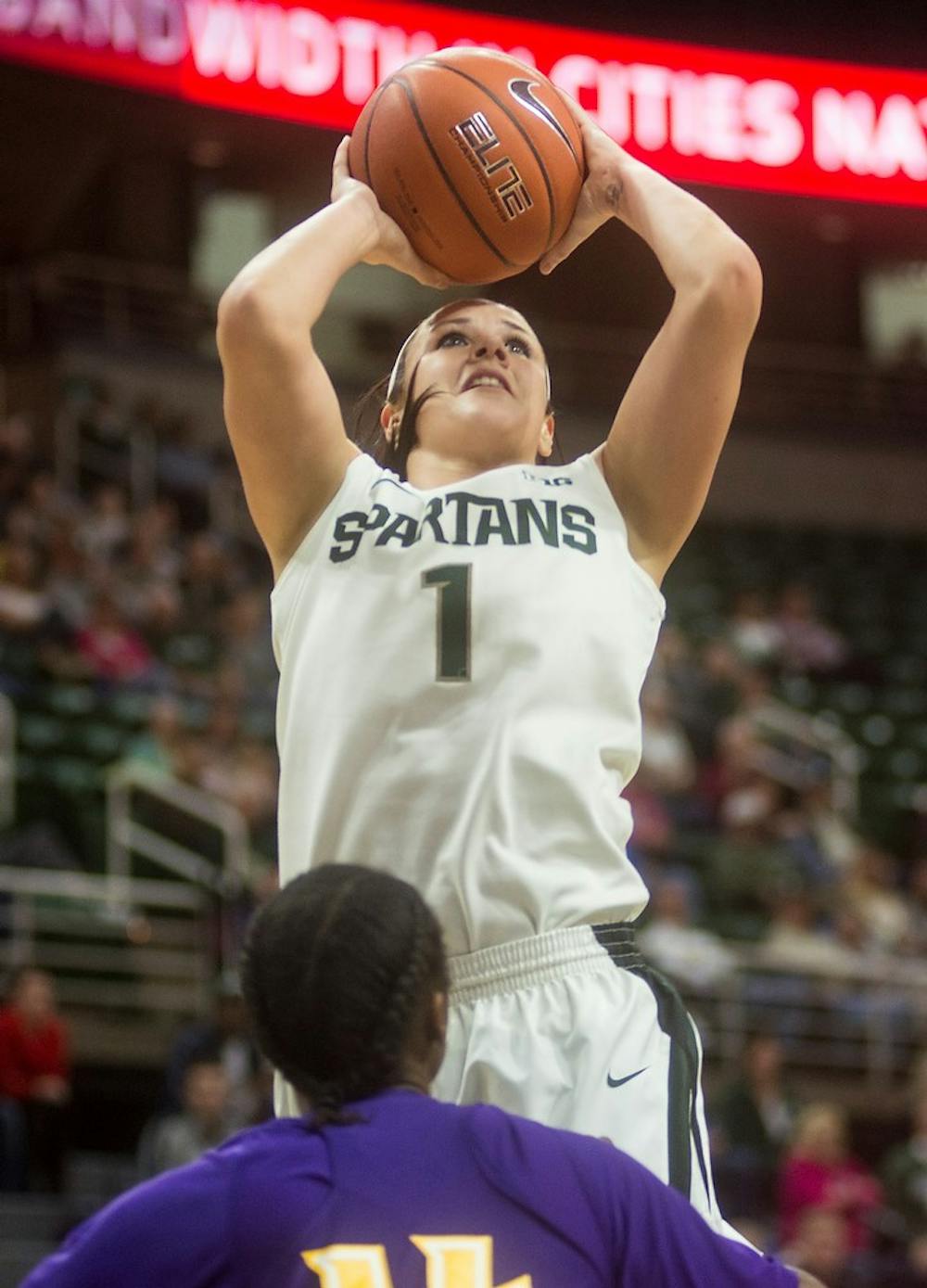 <p>Sophomore guard Tori Jankoska attempts to shoot the ball over Alcron guard Shaqueria Dubose Dec. 16, 2014, during the game at Breslin Center. The Spartans defeated the Braves, . Erin Hampton/The State News</p>