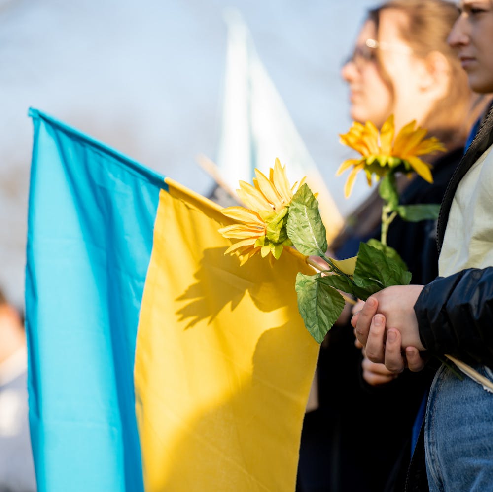 <p>Michigan State students gather at Dem Hall Field for the &quot;Spartans Stand With Ukraine,&quot; rallying for peace in Ukraine on Mar. 1, 2022.</p>