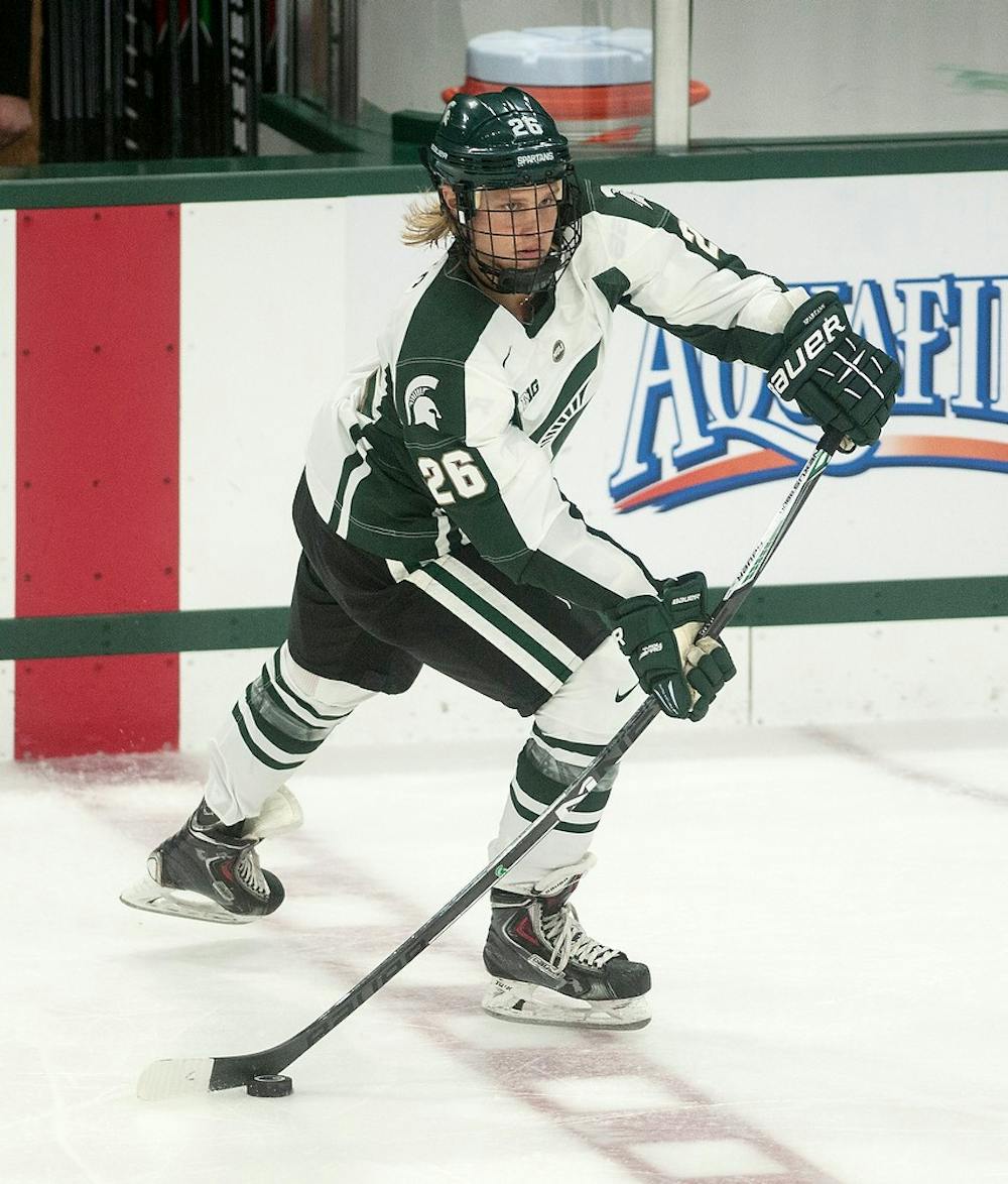 <p>Sophomore forward Villiam Haag controls the puck on Oct. 18, 2014, at Munn Ice Arena during the game against Massachusetts. The Minutemen defeated the Spartans, 4-3. Aerika Williams/The State News</p>