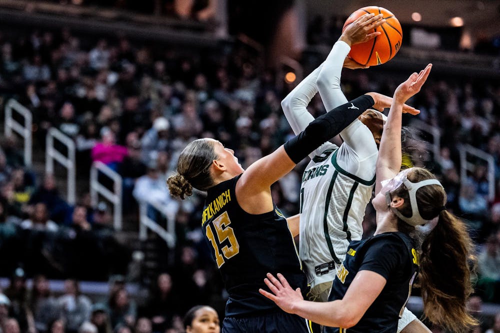 Michigan Wolverines forward Ashley Sofilkanich (15) guards Michigan State Spartans guard Rashunda Jones (1) during the women’s rivalry matchup at the Breslin Student Events Center in East Lansing, Mich., on Sunday, Feb. 1, 2026.