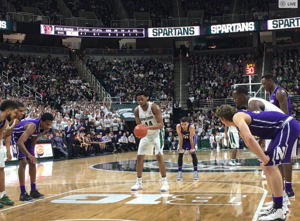 <p>Freshman forward Nick Ward gets ready to take a free throw against the Northwestern University Wildcats on Dec. 30, 2016.</p>