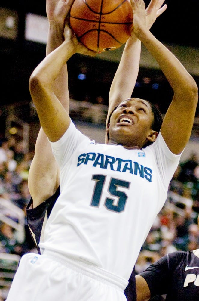 Senior forward Cetera Washington attempts to put up a shot Sunday at Breslin Center. The Spartans defeated the Purdue Boilermakers, 76-57, to improve to 20-3 on the season. Matt Radick/The State News