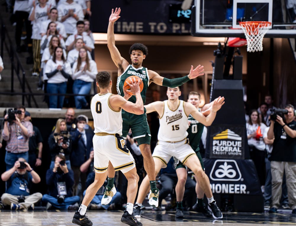 <p>Senior forward Malik Hall (25) guards Purdue's junior forward Mason Gillis (0) during a game against Purdue at Mackey Arena on Jan. 29, 2023. The Spartans lost to the Boilermakers 77-61.</p>