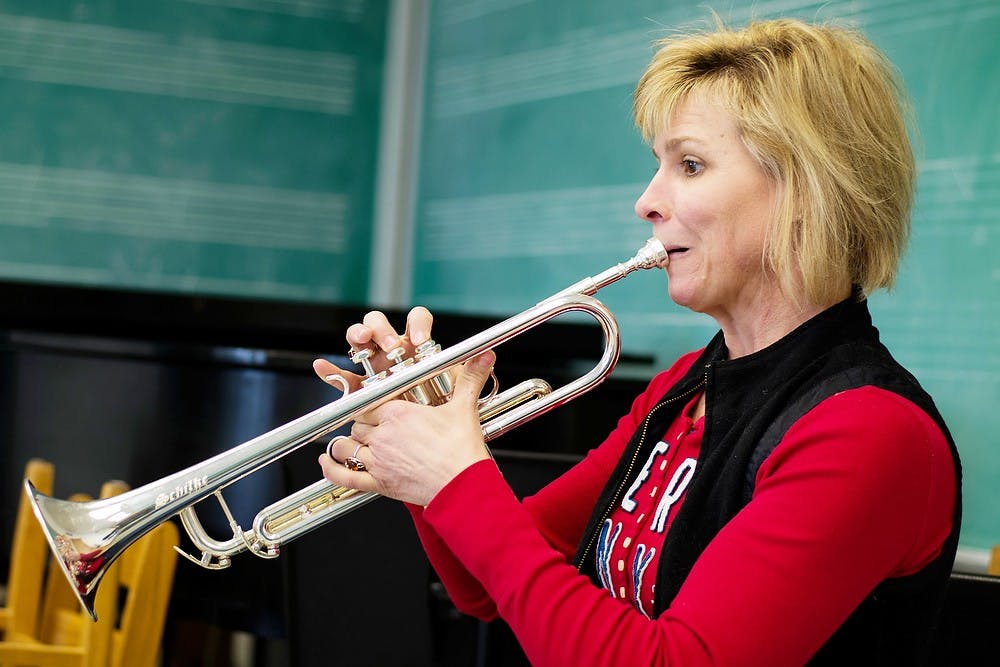 	<p>Graduate student Pamela Smitter practices &#8220;Traveler,&#8221; a piece by David Maslanka, on Feb. 10, 2014 in the Music Building. Smitter is a member of the <span class="caps">MSU</span> Wind Symphony, which will be performing in Carnegie Hall on Feb. 22, 2014.</p>