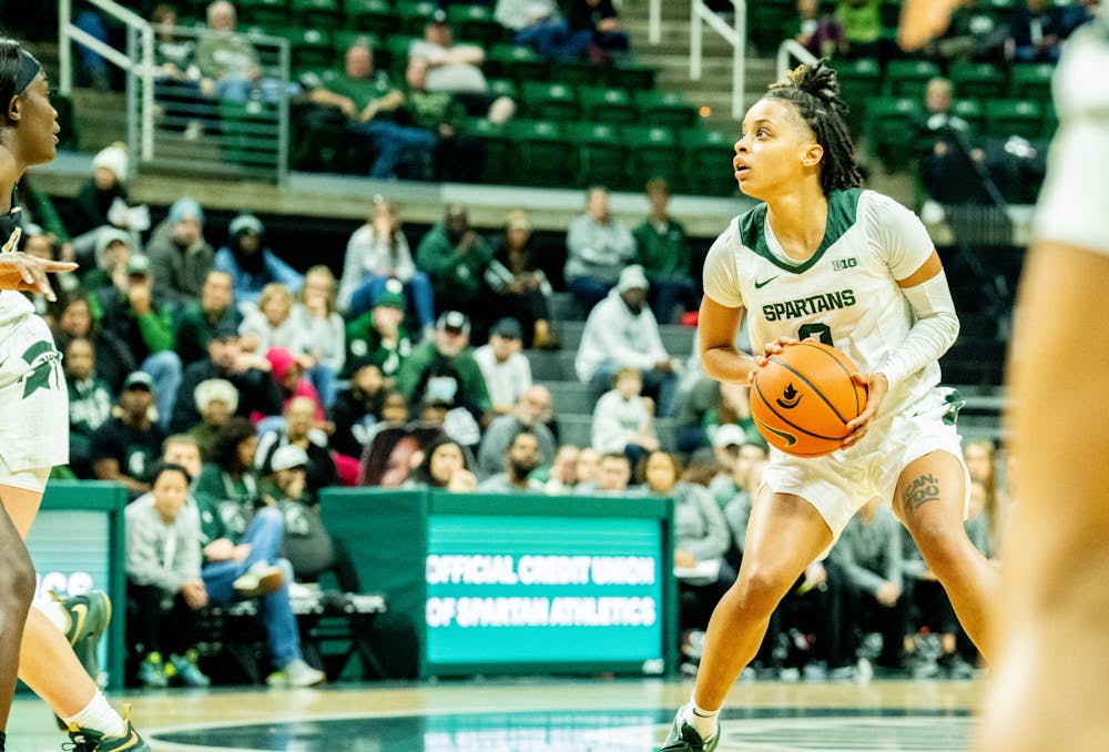 <p>Sophomore guard DeeDee Hagemann (0) eyes the basket as she prepares to shoot at the game against Oakland at the Breslin Center on Nov. 15, 2022. The Spartans defeated the Grizzlies 85-39. </p>