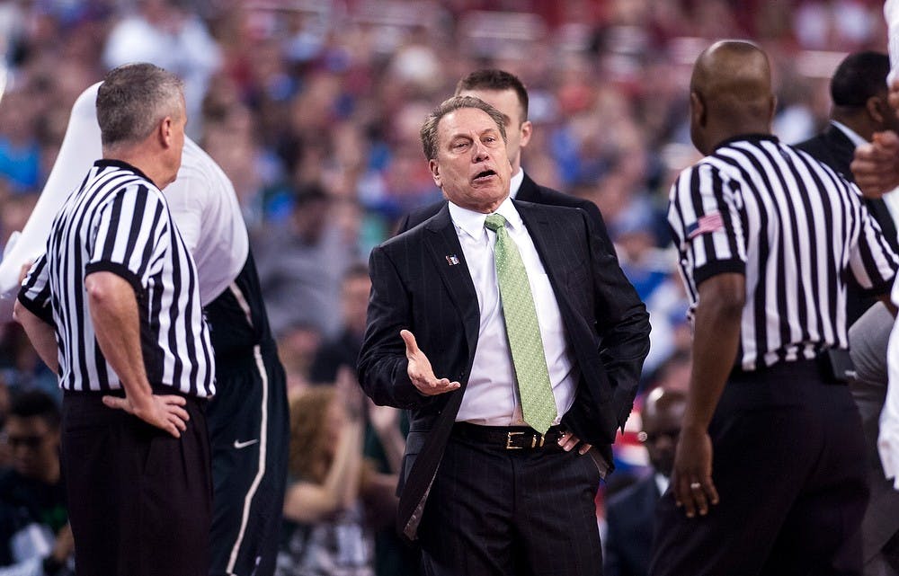 <p>Head coach Tom Izzo talks to the referees April 4, 2015, during the semi-final game of the NCAA Tournament in the Final Four round at Lucas Oil Stadium in Indianapolis, Indiana. The Spartans were defeated by the Blue Devils, 81-61. Erin Hampton/The State News</p>