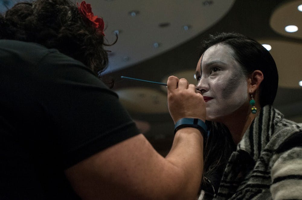 Graduate student Nerli Paredes has makeup applied before a Dia de los Muertos event on Nov. 2, 2016 in the Erickson Hall Kiva. Paredes was a co-coordinator of the event, which honored and remembered the dead. 