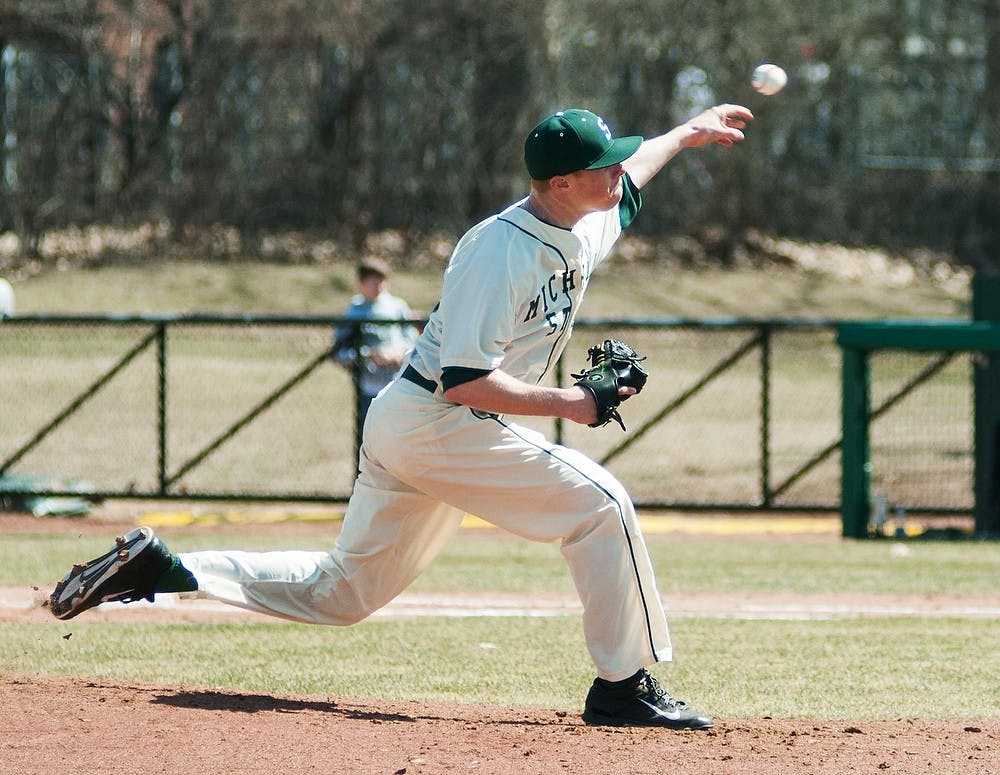 <p>Redshirt freshman pitcher Cam Vieaux warms up during the game against Siena on April 6, 2014, at McLane Baseball Stadium at Old College Field. The Spartans defeated the Saints, 5-1. Danyelle Morrow/The State News</p>