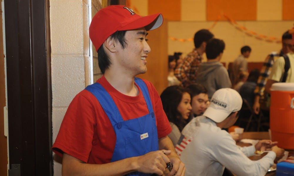 <p>Economics junior Hitoki Okamoto, the Vice President of the MSU Japanese club, dressed as Mario for a Halloween themed Japanese curry party on Oct. 25, 2015.</p>