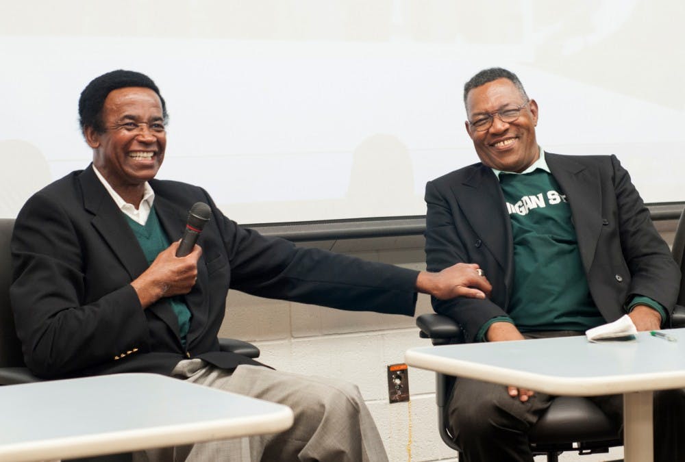 <p>Former Michigan State wide receiver Gene Washington, left, and Clinton Jones share a laugh Sept. 10, 2015, at Conrad Hall, while talking about racial segregation in sports at a preview of Maya Washington's documentary "Through the Banks of the Red Cedar." </p>