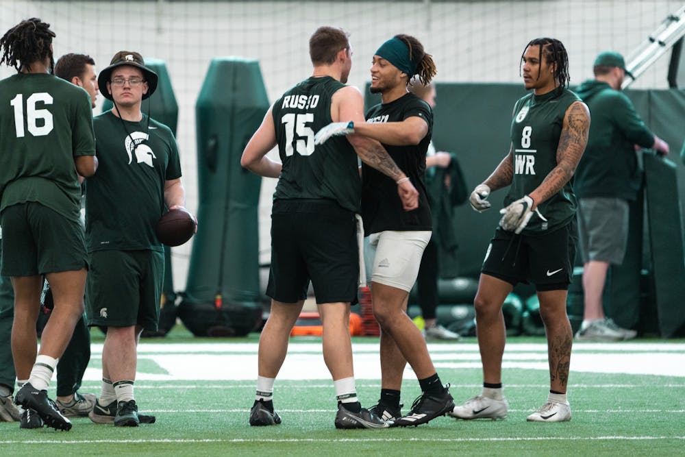 <p>All of the Michigan State specialists celebrating and thanking Michigan State graduate student Anthony Russo for being a great QB for Pro Day on-field position drills, on Mar. 16, 2022 at the Duffy Daugherty Indoor Football Building.</p>