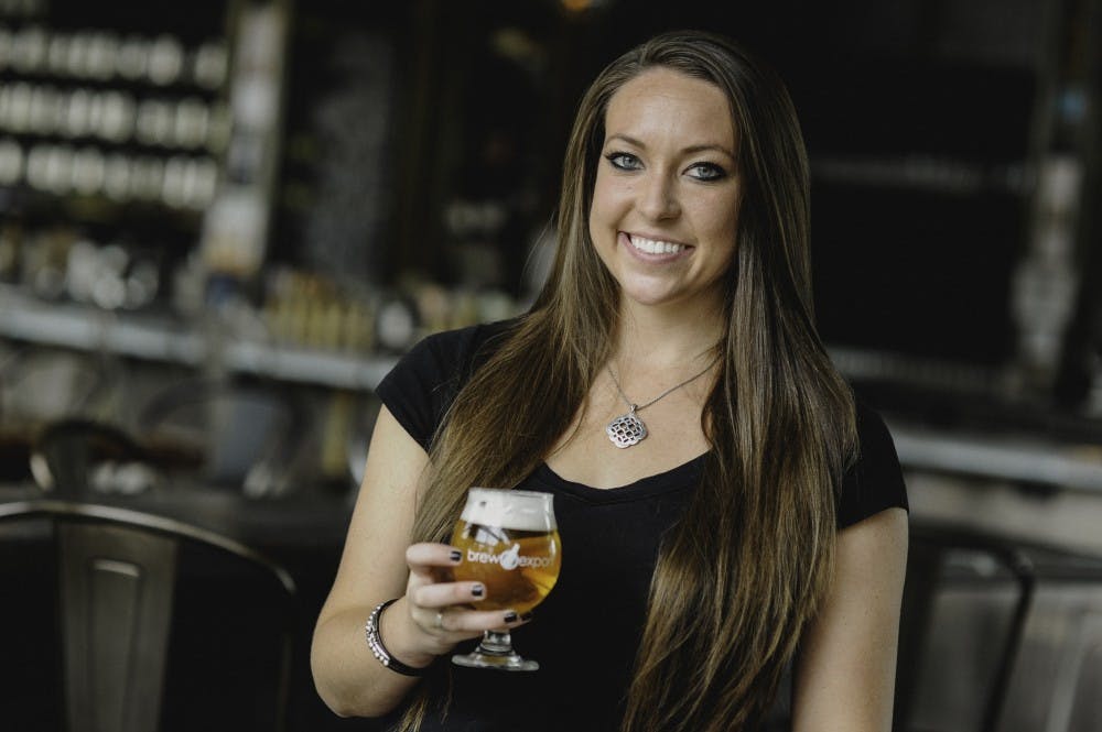 <p>Shannon Long poses for a portrait at Arcadia Ales in Kalamazoo. Long owns Brew Export, a company that&nbsp;takes craft beer from across the nation and ships them overseas to areas of the world where the demand for the type of beer is high. Photo courtesy of Shannon Long.</p>