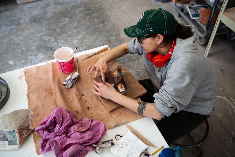 <p>Fourth-year Michigan State studio art student Evan Yalowitz works on a ceramics project for class in the ceramics studio at Kresge Art Center on April 4, 2025. “Ceramics has been tricky — like oil paint, it takes time to master. But I’ve really grown a liking to it,” Yalowitz said.</p>
