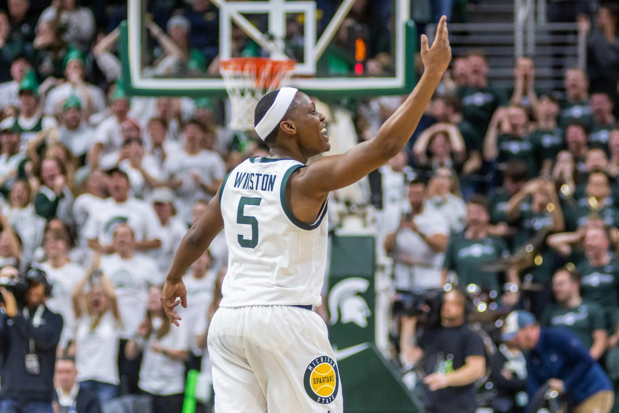 <p>Senior guard Cassius Winston asks for more noise after hitting back-to-back three pointers against Michigan.The Spartans defeated Michigan, 87-69, at the Breslin Student Events Center on Jan. 5, 2020. </p>