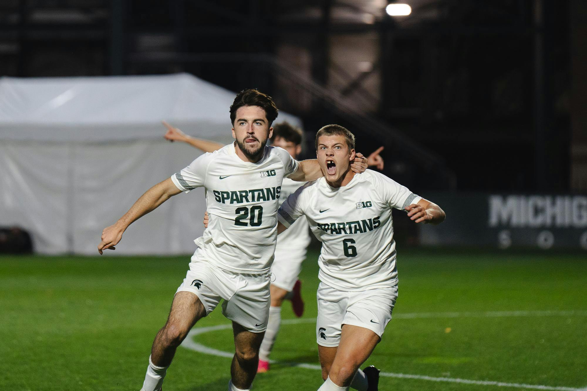 <p>Michigan State senior midfielder Sean Kerrigan (20) celebrates with teammate junior midfielder Jonathan Stout (6) after scoring a goal against Wisconsin at DeMartin stadium on Oct. 11, 2024.</p>