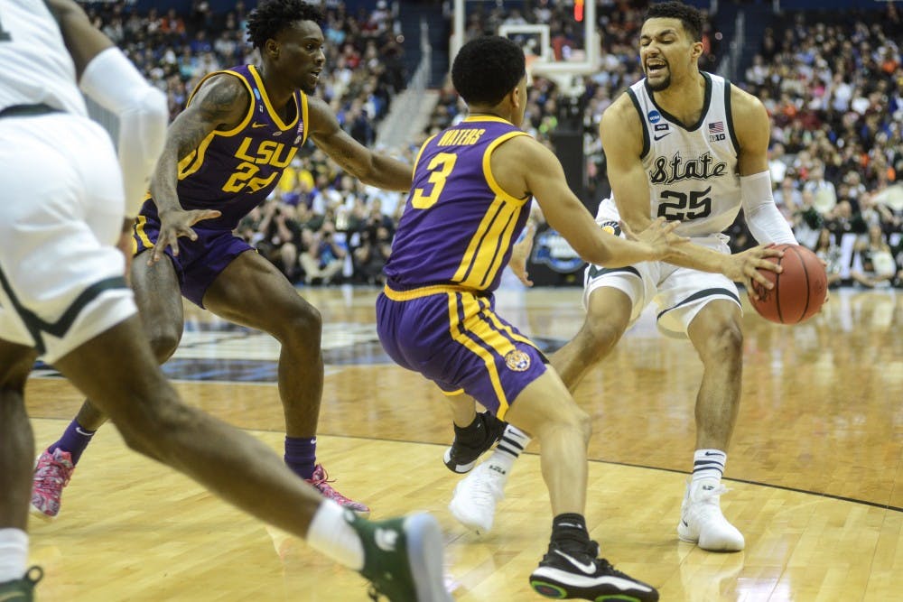 Redshirt senior Kenny Goins (25) moves with the ball during the game against LSU at Capital One Arena on March 29, 2019. The Spartans lead the Tigers at the half, 40-28.