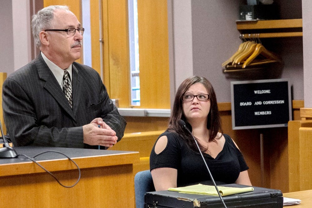 Flint resident Chrystal Atkins looks at her attorney Duane Silverthorn during a pretrial hearing at the 54B District Court on Tuesday morning, July 31, 2012. Atkins is facing charges for armed robbery at the Admiral Gas Station on East Grand River Avenue. Natalie Kolb/The State News
