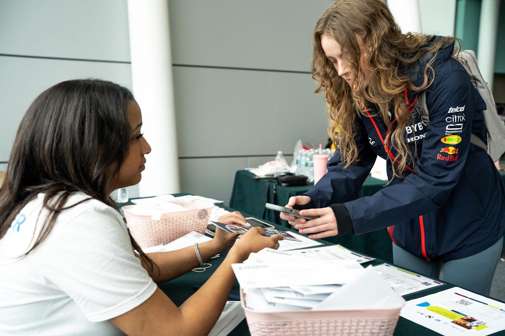 Brione Griffin, left, a second-year medical student and National Marrow Donor Program volunteer, speaks about the importance of becoming a donor in Brody Square on April 12, 2024. The NMDP accepted new donors in Brody Square, with the hope of finding a potential match for a needed transplant. 