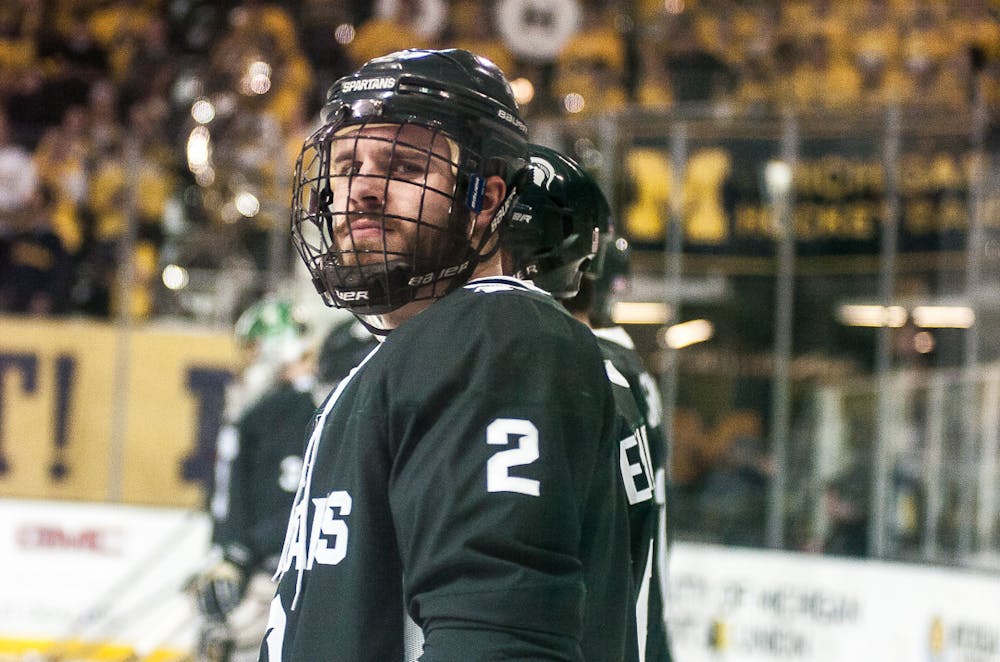 <p>Junior defenseman Zach Osburn (2) looks at the crowd before the game on Dec 7, 2017 at Yost Ice Arena. The Spartans fell to the Wolverines 4-0.&nbsp;</p>