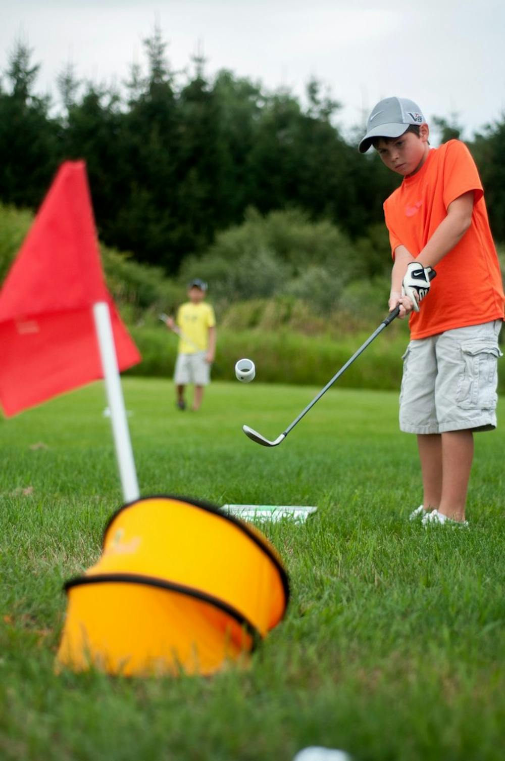 	<p>Mason, Mich., resident Sam Havey, 10, hits the birdie ball August 5, 2013, at North Meridian Road Park during The Meridian Open Championship. Havey finished two under for the round. Weston Brooks/The State News</p>