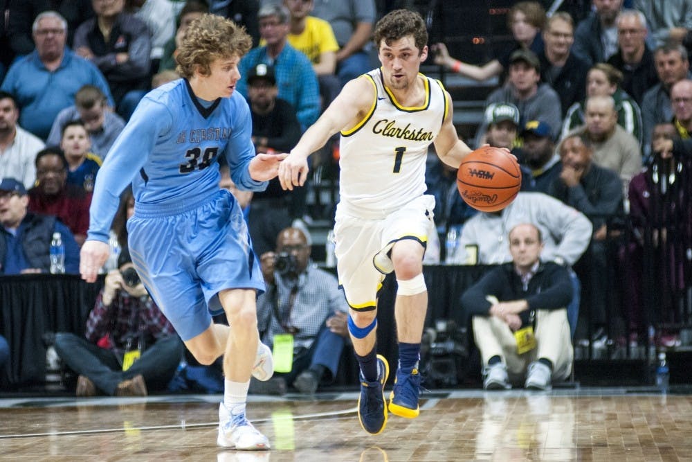 <p>Clarkston’s Foster Loyer (1) drives the ball up the court during the Class A boys basketball state final game on March 24, 2017 at Breslin Center. Clarkston defeated Grand Rapids Christian, 75-69.</p>