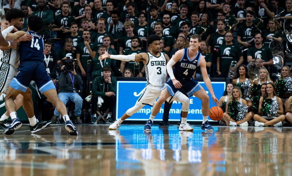 Sophomore guard (3) Jaden Akins guards senior guard (4) Chris Arcidiacono during a game against Villanova at the Breslin Center on Nov. 18, 2022. The Spartans defeated the Wildcats 73-71. 